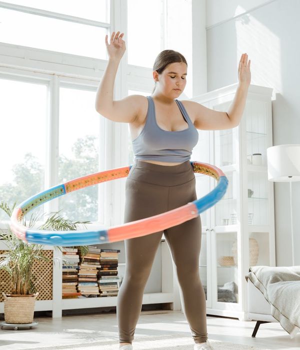 Active young person doing light cardio movements at home